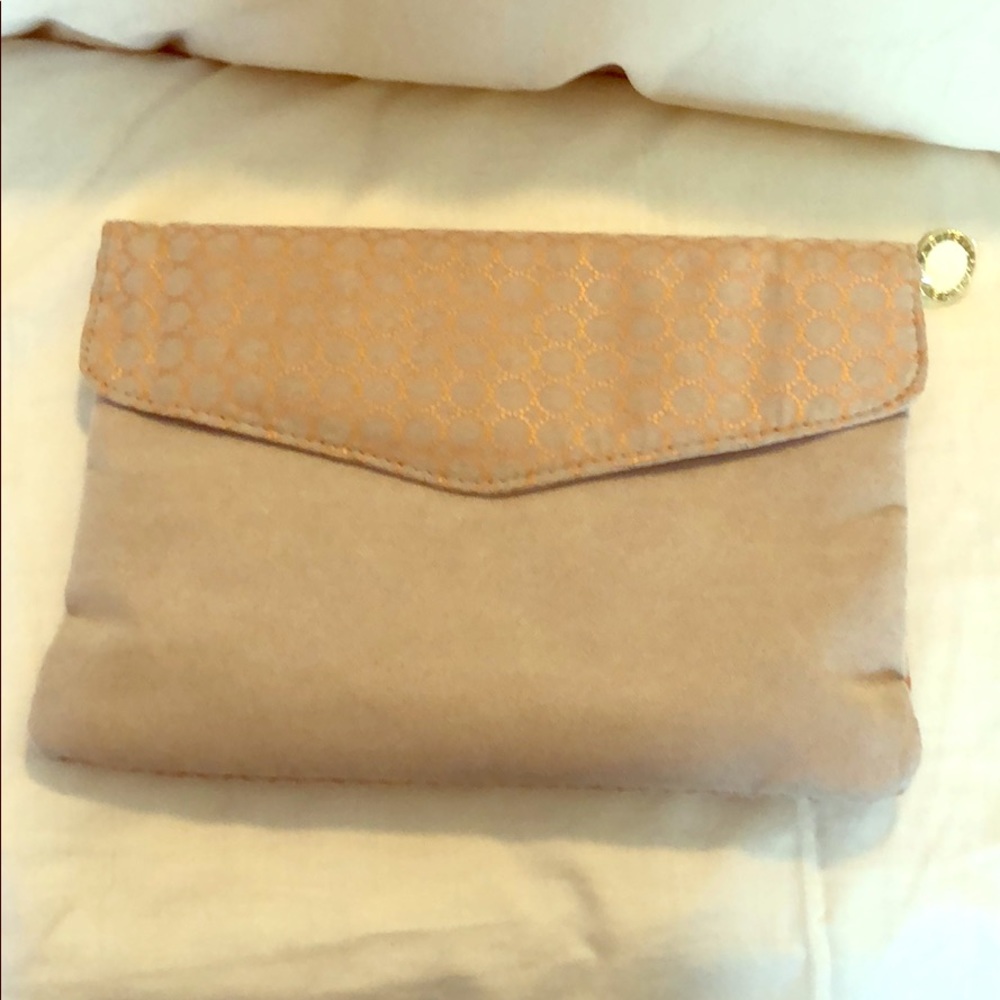 Useful and elegant clutch/travel pouch.